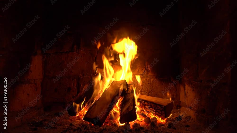 A fire burns in a fireplace, Fire to keep warm A fire burns in a fireplace, Fire to keep warm