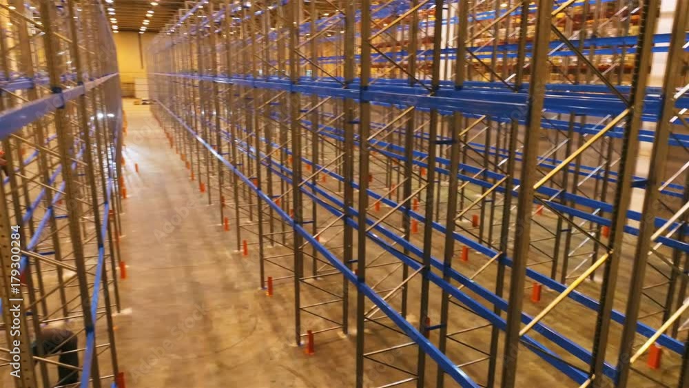 View on Assembled Large Empty Metal Racks in Warehouse View on Assembled Large Empty Metal Racks in Warehouse