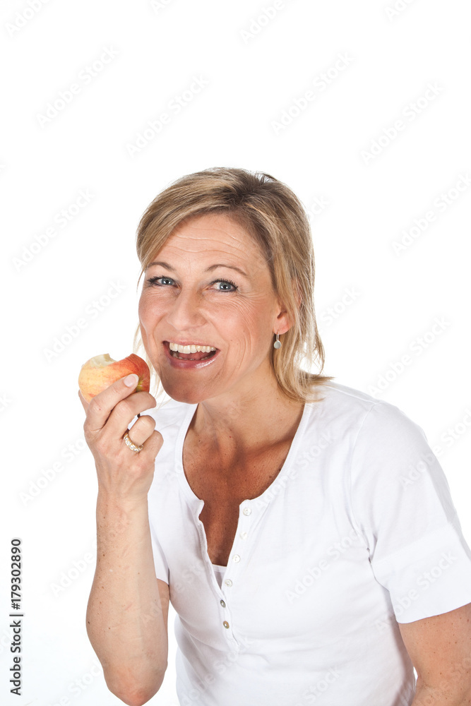 Blond cute woman eating an apple Blond cute woman eating an apple