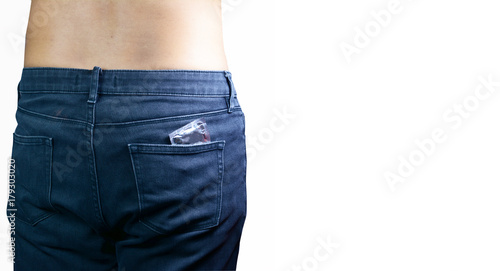 the back of a man with black jeans with a white pack of condom in the pocket