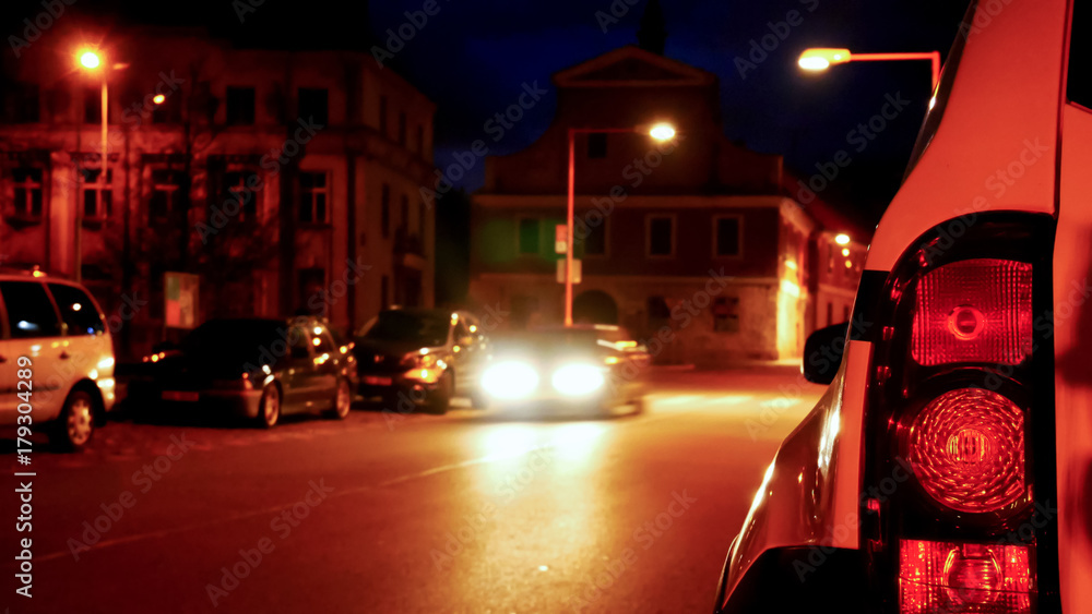 Fototapeta premium Back Light of Car in the Night Town.