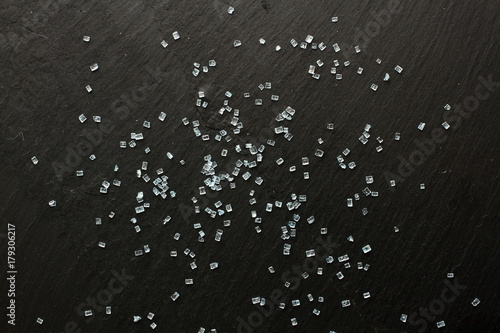 Decorative blue sugar crystals on black background