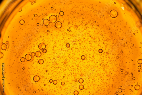 Close Up Macro Shot Of Honey Bubbles