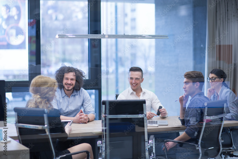 Startup Business Team At A Meeting at modern office building