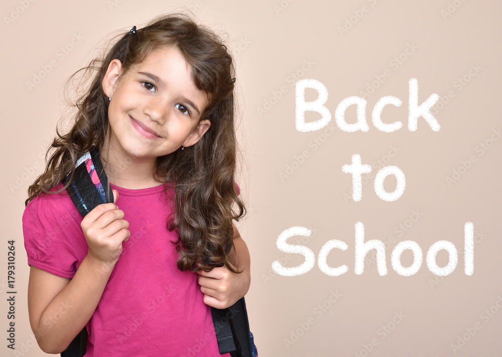 Smiling cute young girl with text Back to School Smiling cute young girl with text Back to School