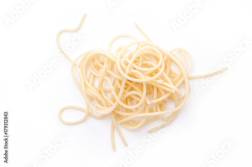 Plain cooked spaghetti pasta pile, on white background.