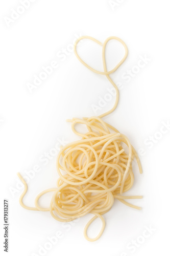 Plain cooked spaghetti pasta pile with heart, on white background.