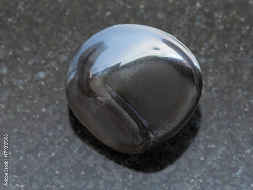polished obsidian gemstone on dark