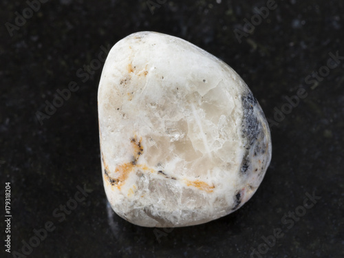 tumbled baryte stone on dark background