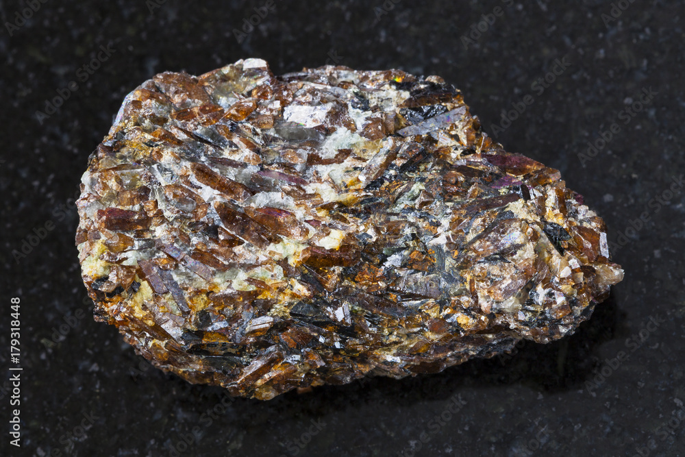 rough Titanite stone on dark background rough Titanite stone on dark background