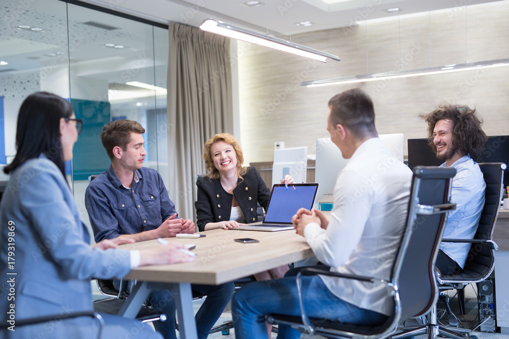 Startup Business Team At A Meeting at modern office building Startup Business Team At A Meeting at modern office building