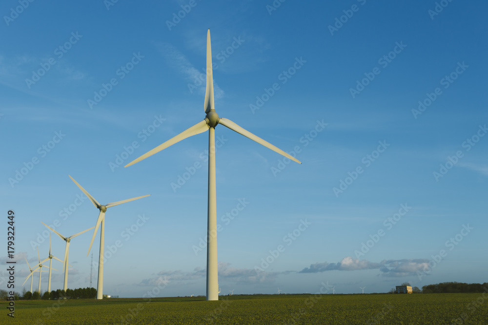 Wind turbines of a power plant for electricity generation in Normandy, France. Concept of renewable sources of energy. Environmentally friendly electricity production. Toned