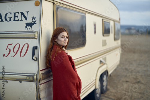 Caucasian woman leaning on motor home photo