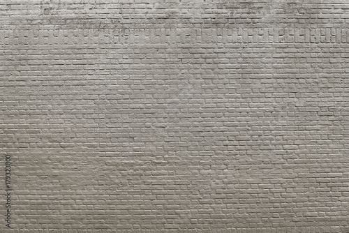 Old grey brick wall background texture