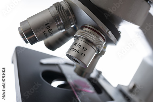 Laboratory microscope isolated on white background close up - detail