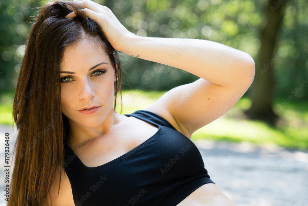 Portrait of a beautiful confident young woman doing fitness exercise Portrait of a beautiful confident young woman doing fitness exercise