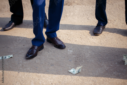 man throws money on the ground