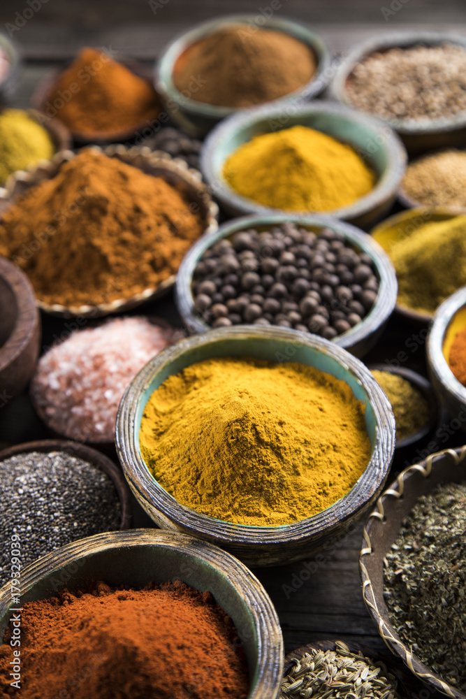 Spices on wooden bowl background Spices on wooden bowl background
