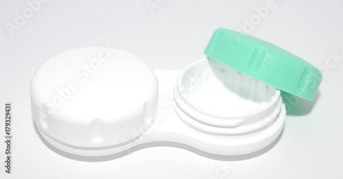white and green contact lens case on a white background