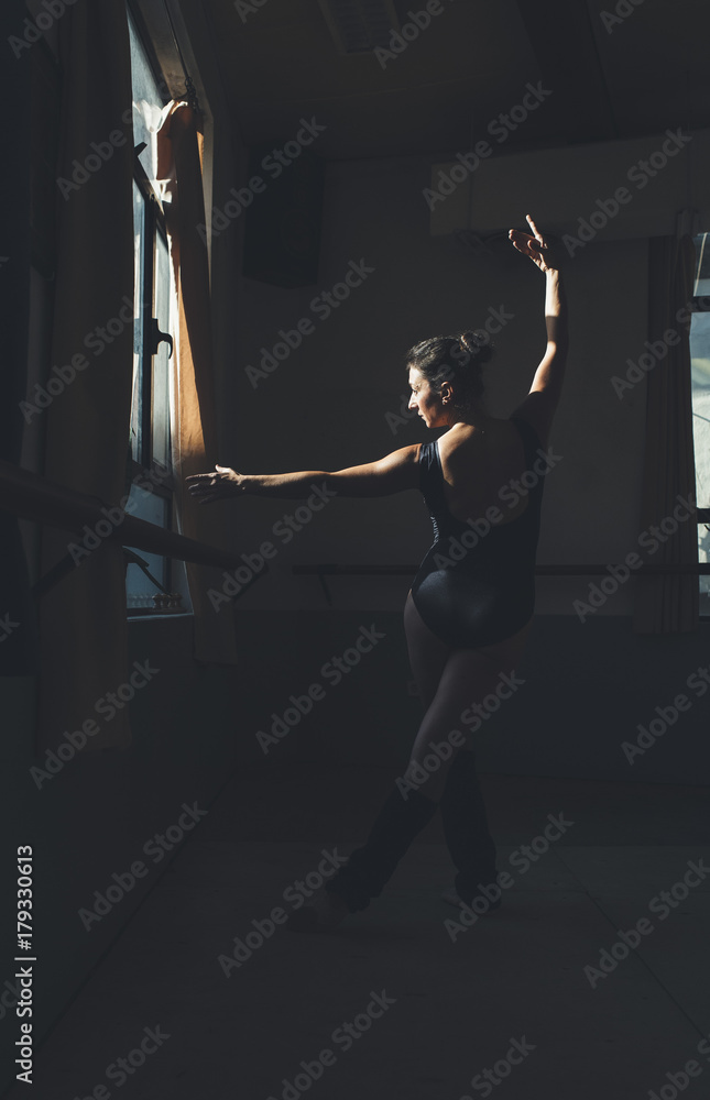 Ballet dancer practicing indoors. Ballet dancer practicing indoors.