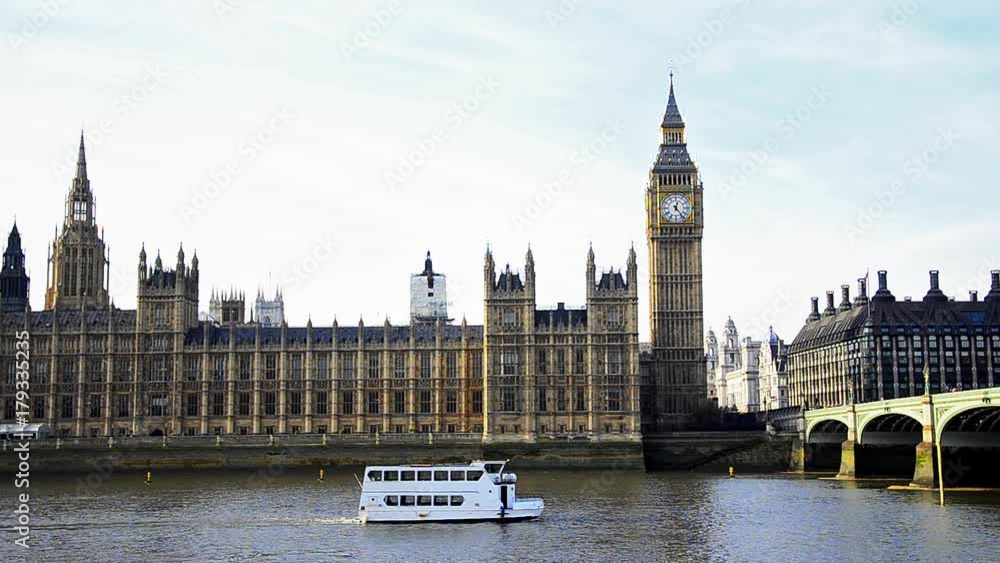 London Tourist boat on Thames river with Big Ben, Houses of Parliament, and London Bridge at background London Tourist boat on Thames river with Big Ben, Houses of Parliament, and London Bridge at background