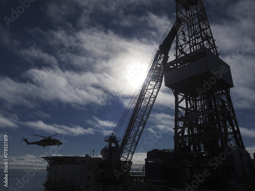 Obraz na plátně helicopter landing on an offshore drilling platform, oil and gas industry
