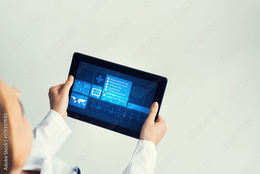 Close of female doctor hands working with tablet pc computer Close of female doctor hands working with tablet pc computer