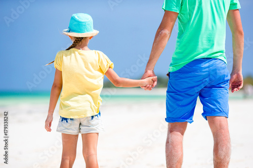 Little girl and dad during tropical beach vacation © travnikovstudio