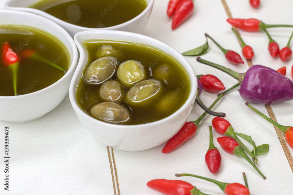 Olive oil,olives and red peppers. Olive oil,olives and red peppers.