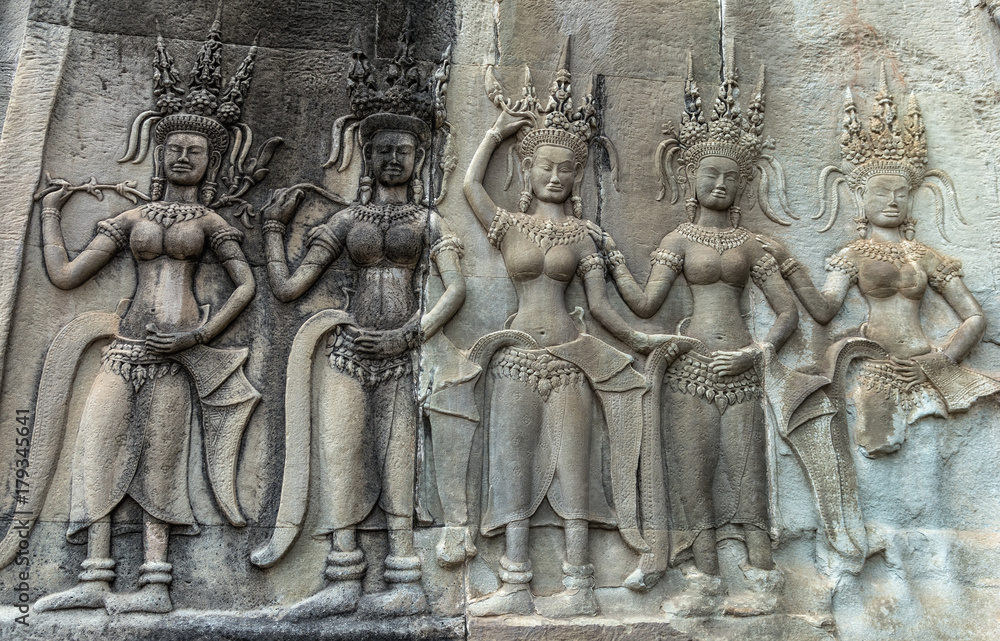 Detail of a Stone Carved Relief in the famous Angkor Wat in Cambodia and the largest religious monument in the world. Location: Siem Reap, Cambodia. Artistic picture. Beauty world.