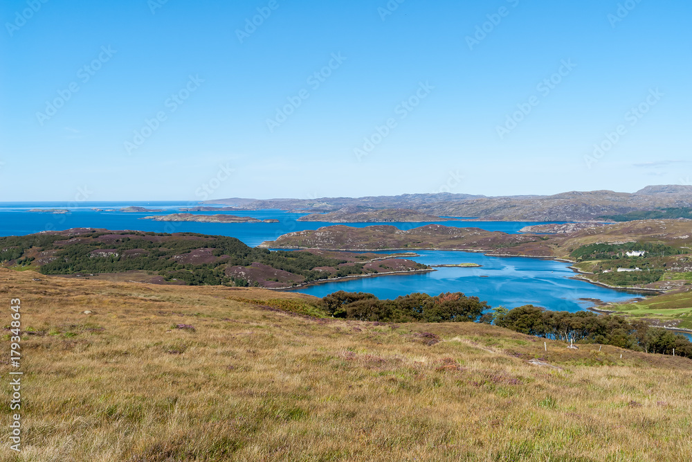 Typical Scottish Highlands seascape with islands ans isolated houses - Western Highlands, Scotland, UK Typical Scottish Highlands seascape with islands ans isolated houses - Western Highlands, Scotland, UK