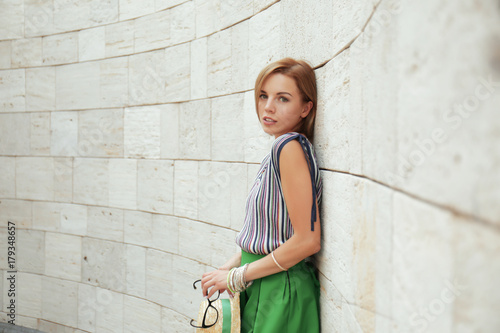 Young stylish woman in gree...