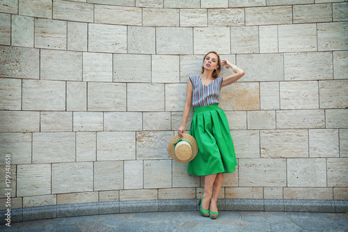 Young stylish woman in gree...