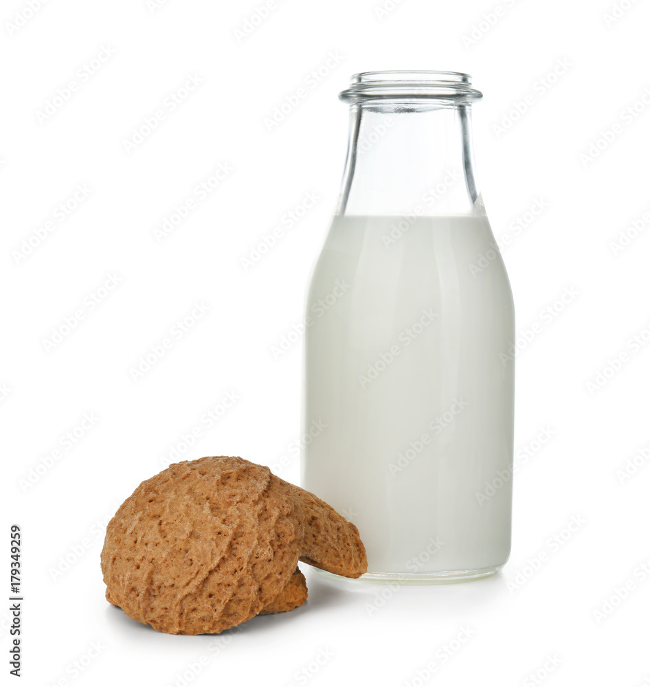 Delicious oatmeal cookies with bottle of milk on white background Delicious oatmeal cookies with bottle of milk on white background