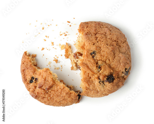 Delicious oatmeal cookie with raisins on white background