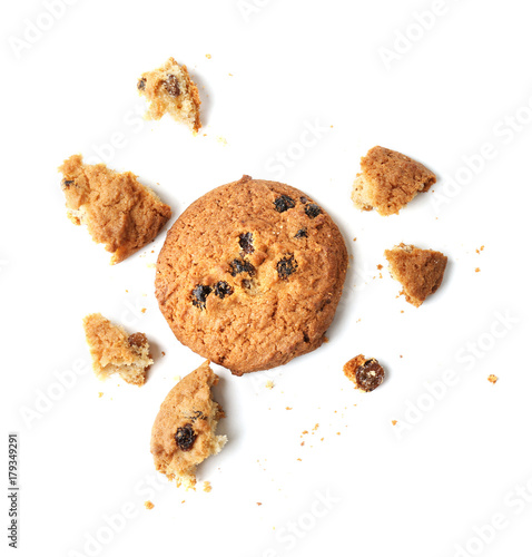 Delicious oatmeal cookie with raisins on white background