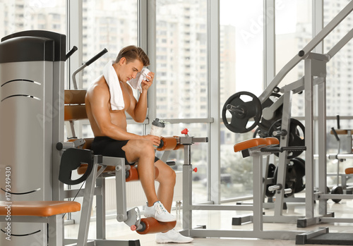 Sporty young man training in gym © Africa Studio