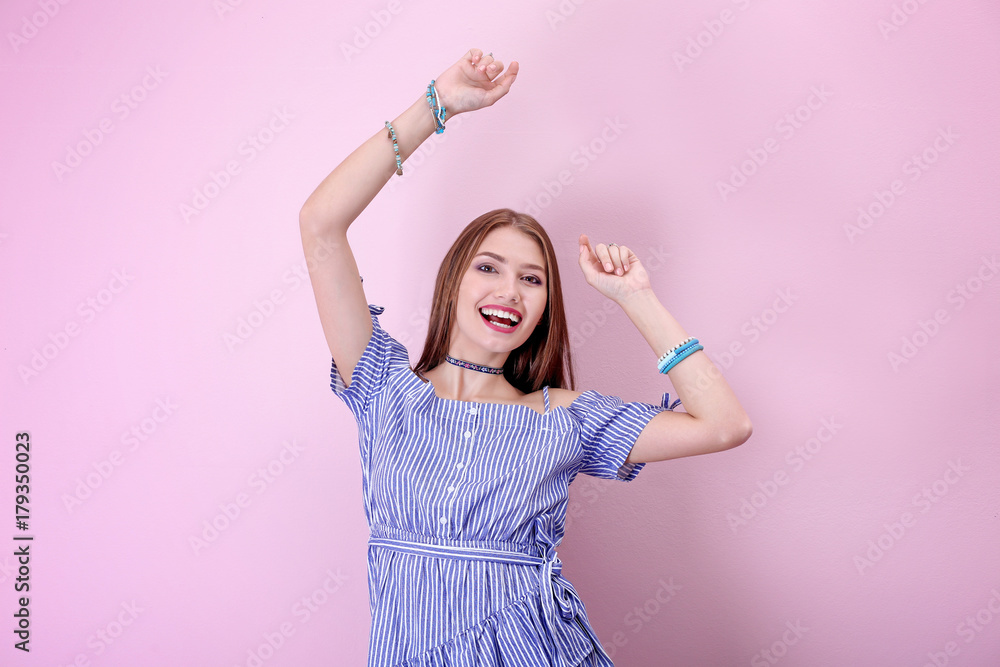 Attractive hipster girl posing on color background Attractive hipster girl posing on color background