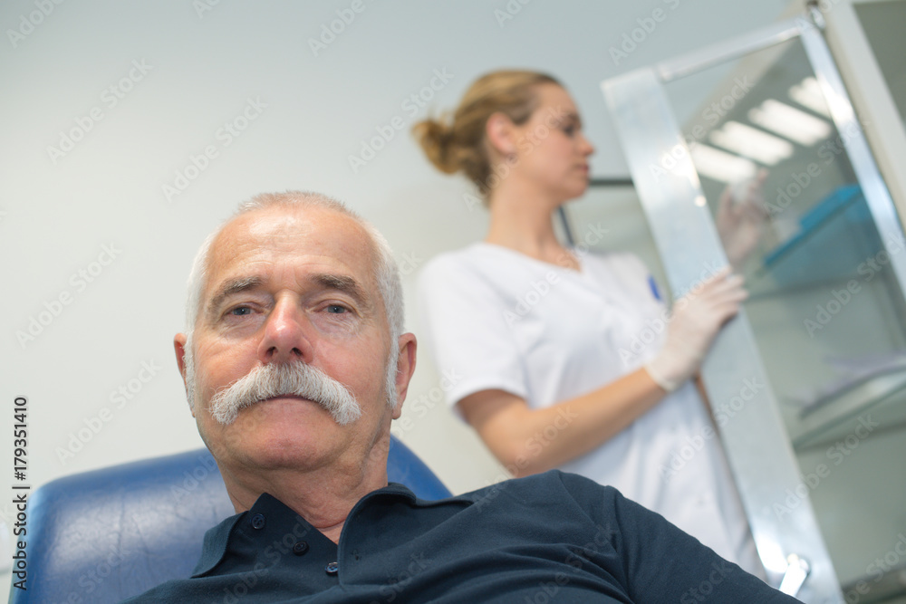 old man waiting on the clinic for blood extraction old man waiting on the clinic for blood extraction