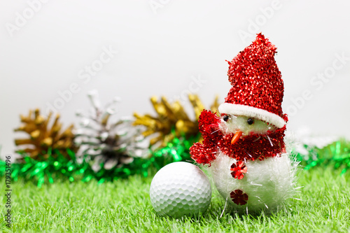 Golfer Christmas holiday concept with golf ball and Christmas decoration