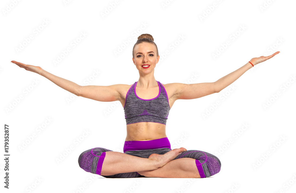 Women who do yoga perform sitting on the floor. Lotus pose. Women who do yoga perform sitting on the floor. Lotus pose.
