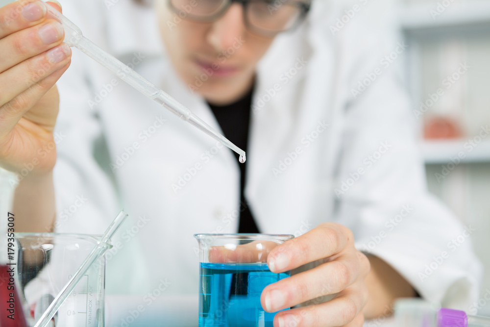 young women science professional pipetting young women science professional pipetting