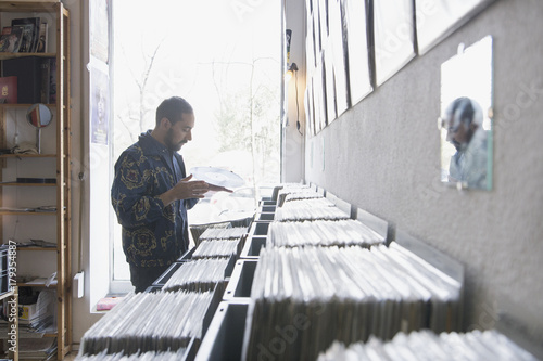 Young man shopping for records