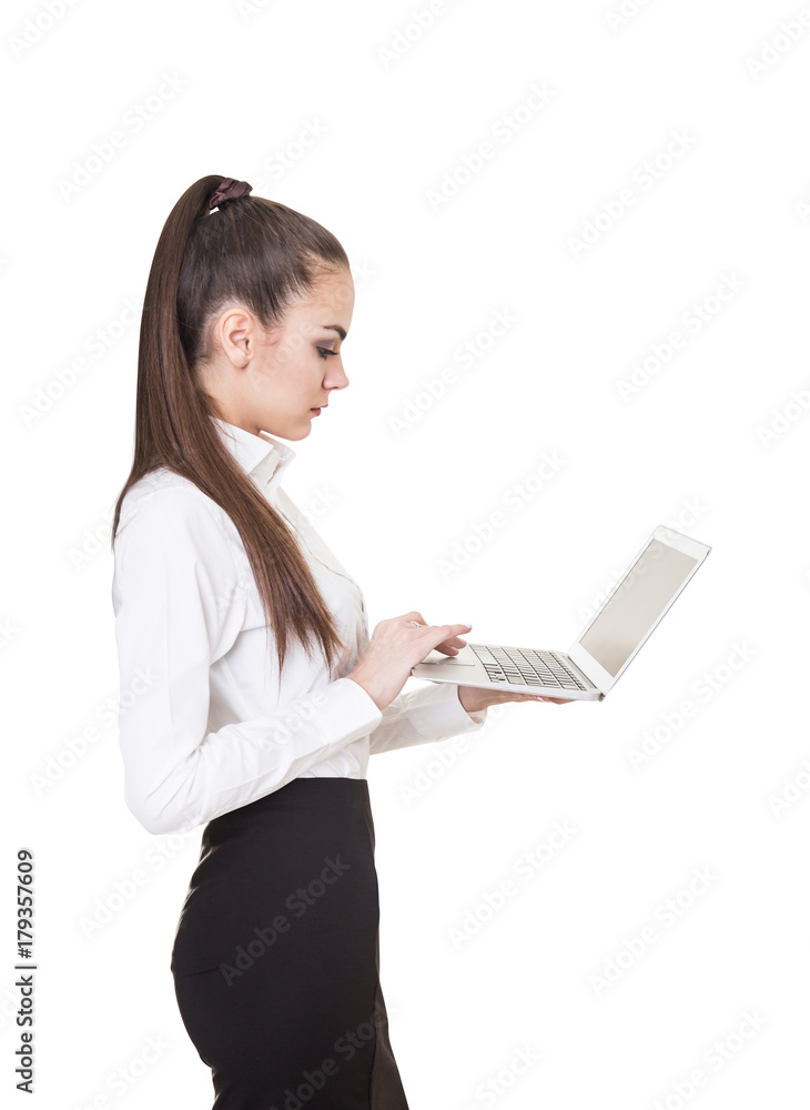 Serious young businesswoman holding a laptop Serious young businesswoman holding a laptop