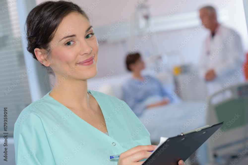 Portrait of nurse holding clipboard Portrait of nurse holding clipboard
