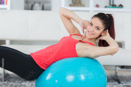 pilates woman doing fitball exercise workout at gym photo