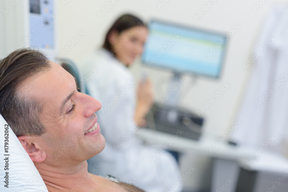 man undergoing chest examination man undergoing chest examination