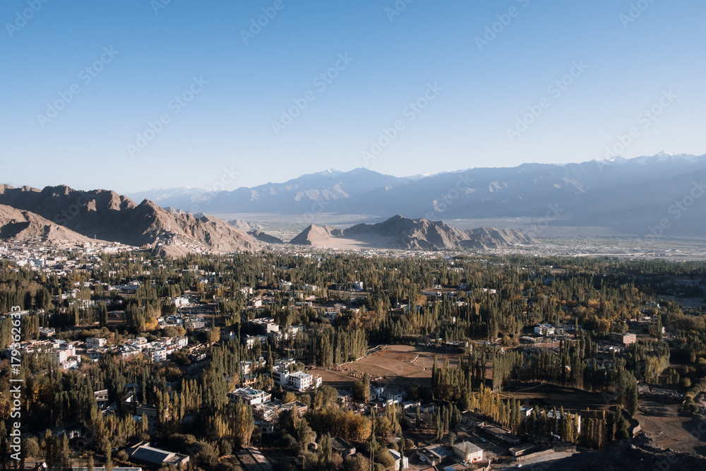 Landscape and building in Leh Ladakh city with mountains and blue sky background