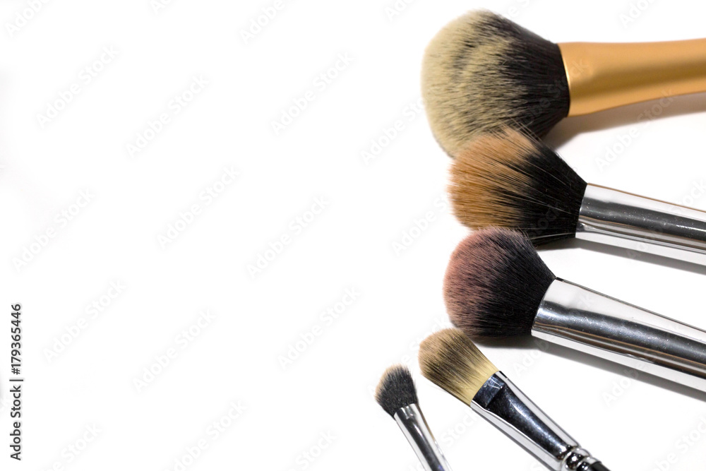 Various sizes and shapes of makeup brushed in isolated white background Various sizes and shapes of makeup brushed in isolated white background