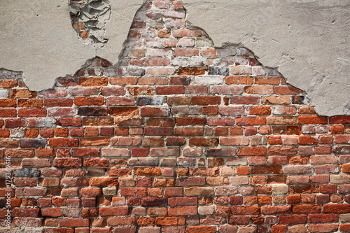 Old crumbling brick wall photo